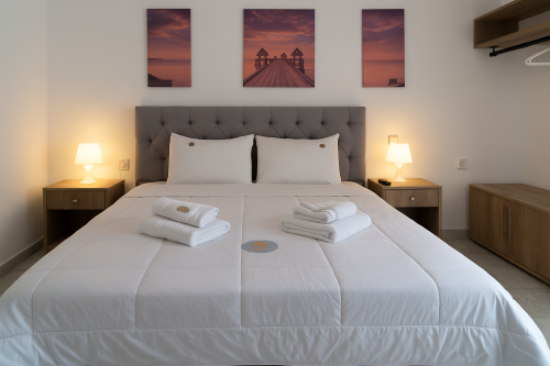 a_photograph_showcases_a_bedroom_during_daytime_wi